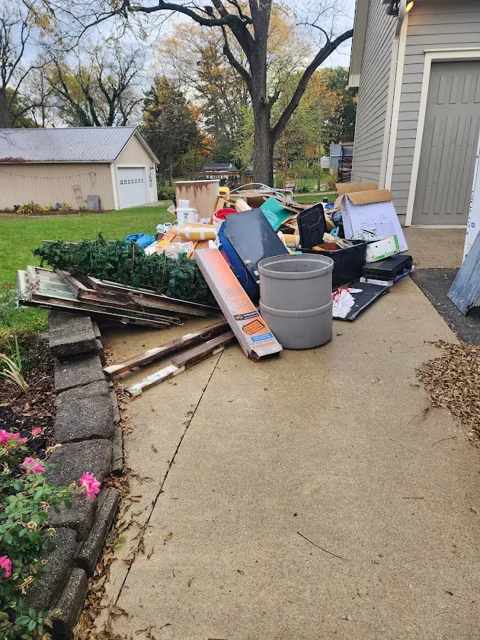 Dumpster being loaded with debris for Demolition Dumpster Rental in North Tonawanda